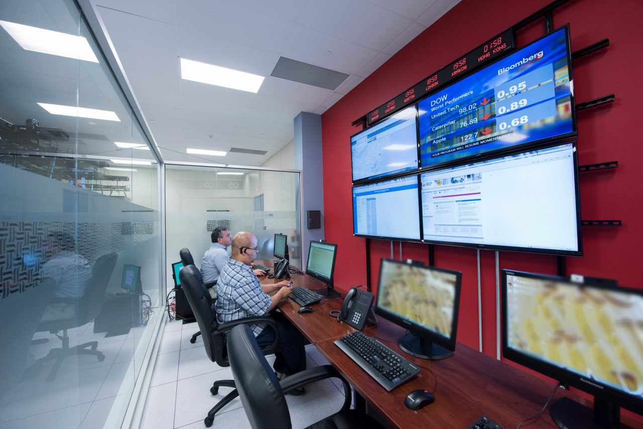 2 Seed4equityer Sitting at Their Computers in Data Center